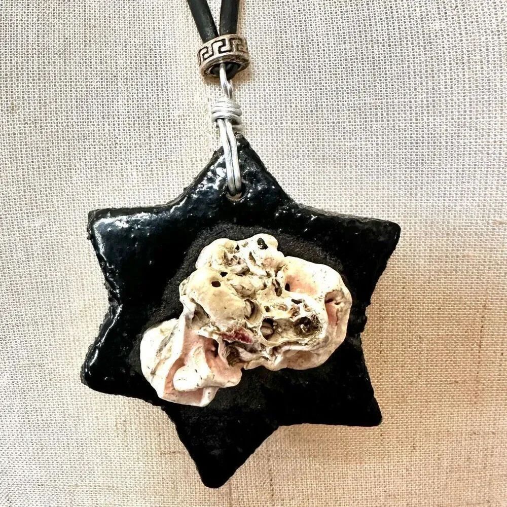 Black star with shell design pendant necklace